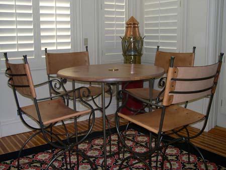 1 café table with 4 leather chairs 2 room rug