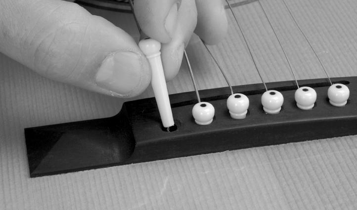 Installing the tuning machines Clean out any excess finish from the tuner post holes so that the tuning machines fit easily into their hole.