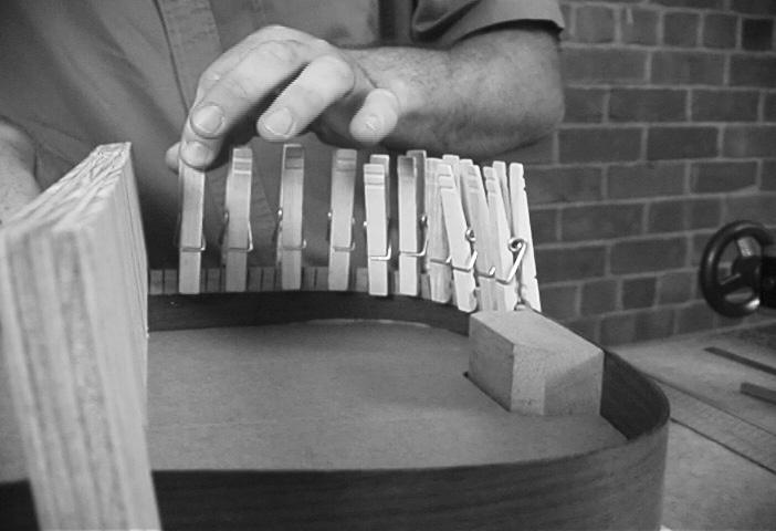 Each side of the guitar requires two strips, which should be accurately trimmed where they meet the body blocks. Use at least four or five dozen clothespins.