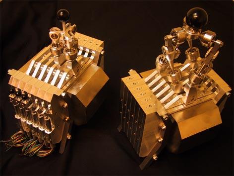 This stacking creates a single magnetic flow circuit that is shared by all the coils and results in a highly compact structure (Fig.