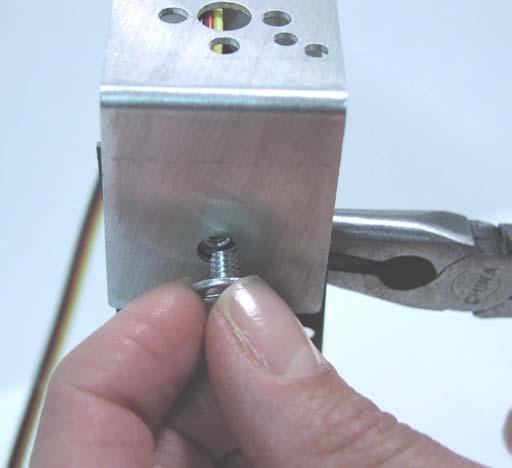You may want to use a small flat head screwdriver. Then finish by screwing the screw all the way in, see figures 10 and 11.