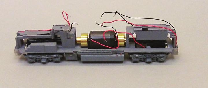 After the board has been removed, remove the rear weight by removing one screw near the end of the loco.