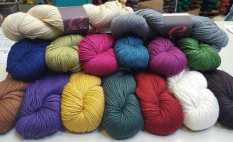 retails for $5.50 per ball. Pictured is the pattern for a hooded pullover, of which we have the display!