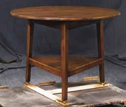 72870 Preble Cricket Table H26 Dia.27 Round table with three tapered and splayed legs. Bottom shelf.