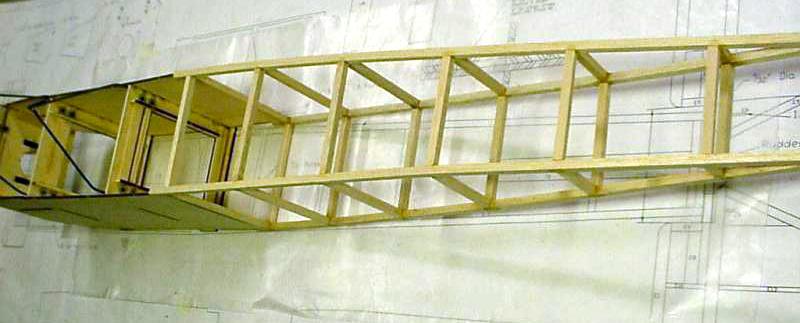 Building of the Right Side of the Fuselage Begin by building two rear fuselage frames over the plan and allow to dry. Select hard balsa or basswood for the longerons.