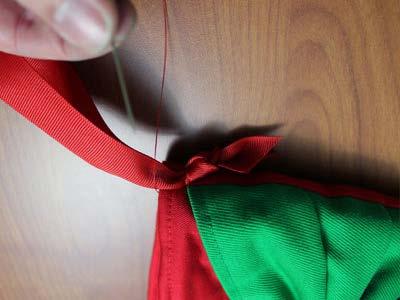 To prepare the hanger, cut an 18" length of 1/2" - 1" wide ribbon and tie the raw