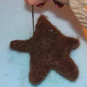 Pull the mold off the felted piece.