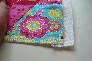 At your sewing machine, pull the zipper pull down so that the zipper is open a couple of inches.