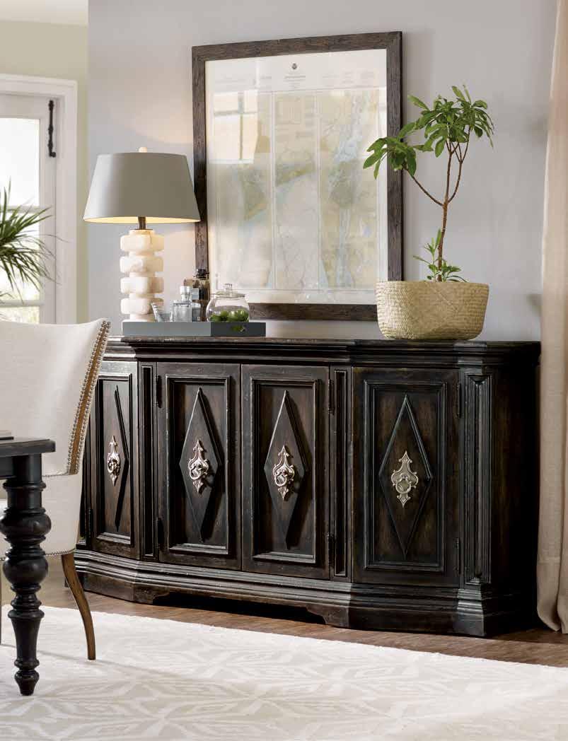 Alluring accents offered in the Auberose Collection include the dramatic hall console and carved landscape mirror.