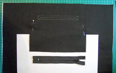 With right sides together and carefully matching the gathered strips, sew the side seams.