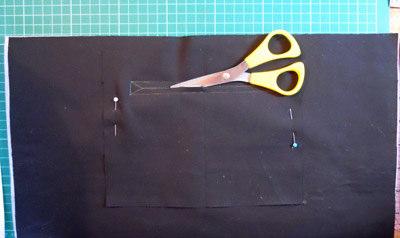 Sew the pocket to the bag lining piece along the marked outside lines of the rectangle.