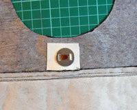 Open out and topstitch to flatten the seam neatly. Next, insert the magnetic clasp to each side of the lining.