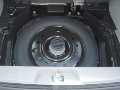 This task is started by removing the spare tire from the rear cargo area: You need to remove the rear cargo pan drain hole cover.