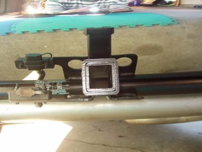 Lastly, install the dust cover on the four wire trailer connector that is hanging under the floor from the grommet and secure the connector to the plastic mounting bracket.