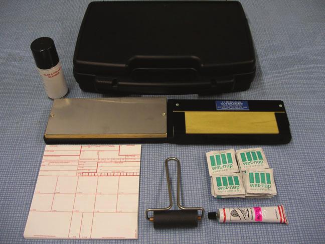 Chapter 2 2-4. Figure 2-1 is an example of a typical commercially available fingerprint identification kit. The minimum contents of this kit should include the following: Carrying case.