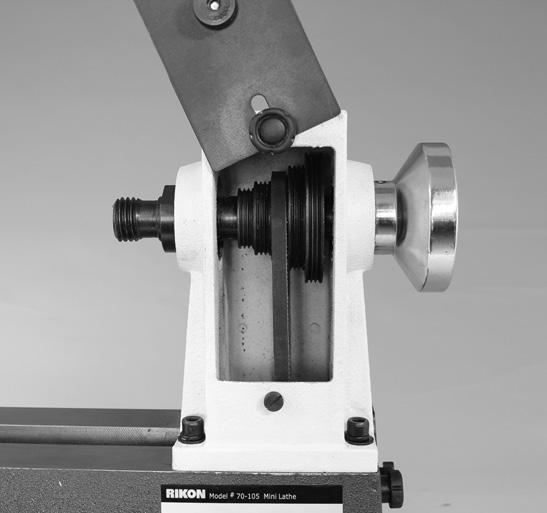 .. With the access covers open, loosen the locking lever handle (F) that secures the motor in place, and raise the motor mounting plate lever (G) to release the belt tension on the motor and spindle