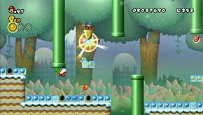 You need to inch out to the area with the coin and hit out a block or two above it, but don't go too far or the Piranha Plants on the overhang ahead will melt your path out of the level!