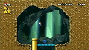 Run to the top of the screen to enter a secret area with a 1-Up.