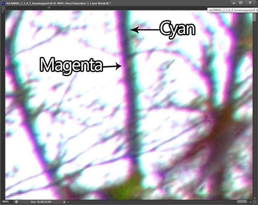 * You should see a Hue/Saturation layer added to your Layers Palette. Zoom into the areas of high chromatic aberration by 3-400%.