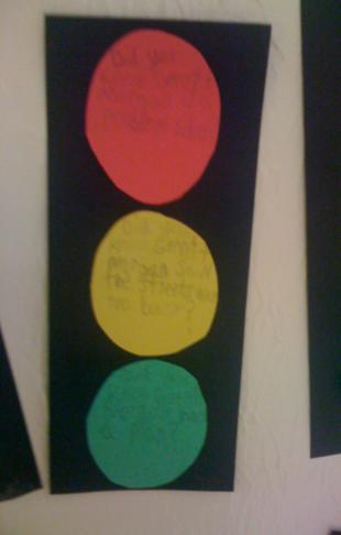 Cut out circle pattern. Trace and cut out one red, yellow, and green circle.