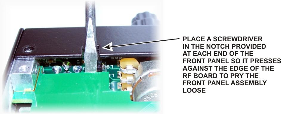 CAUTION: Before continuing on with the next step, be sure you have removed the three top Front Panel Assembly screws shown in Figure 5.