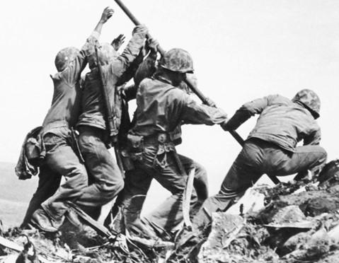 Contrast those with the pants worn by the figure said to be Bradley in the famous Joe Rosenthal photo Foley studied dozens more photos taken on Iwo Jima that day, and his eyes kept coming back to the