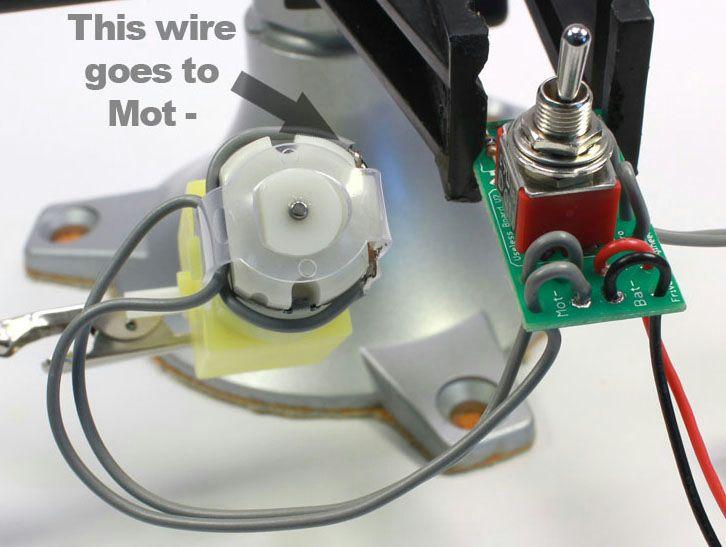 Split the conductors on the motor leads about 4cm (1.5 inches) & thread the wires through the strain relief holes in the The silver colored conductor from the motor goes to Mot on the board.