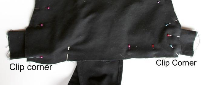 This will help the seam allowance to fold in when turning the carrier right side out. When stitching along bottom straight edge of carrier make sure waist straps are not in the way.