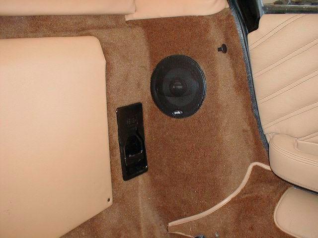 Interior Console Speaker recessed into carpet Fiero roof release Door Panels The door panels are secured to the frame by an L bracket accessible through the speaker opening.
