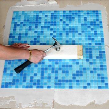 Step 11: Even the Tile Surface Using a wooden beating block and light tapping with a hammer