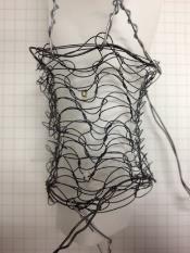 The two types of the knitted specimens, plain loop knit and garter loop knit, were made of the 5 m wire, using a lilyyarn knitting machine.
