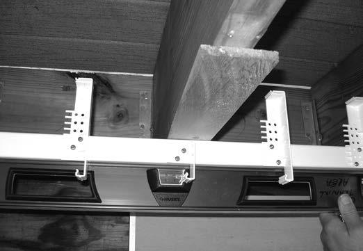 ATTACH GRID BARS CONTINUED Step 3: Attach grid bars to underside of deck using 2-1/2" stainless steel screws.