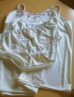 If the lace is very soft or slack, sew clear elastic to the wrong side of the top edge of the lace. First machine baste it to the wrong side of the lace. Stretch the elastic when basing.