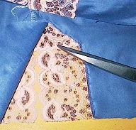 Another design idea Cut one or more motifs of lace fabric to decorate the edges of the garment as in the other camisole.