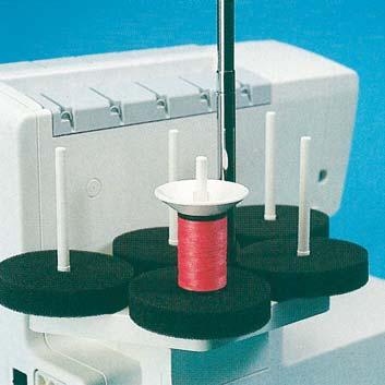Place the spool on the spool holder catching the bottom of the thread net with the spool pin.