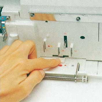 Move the looper disengaging lever to the right, thus re-engaging the upper overedge looper.