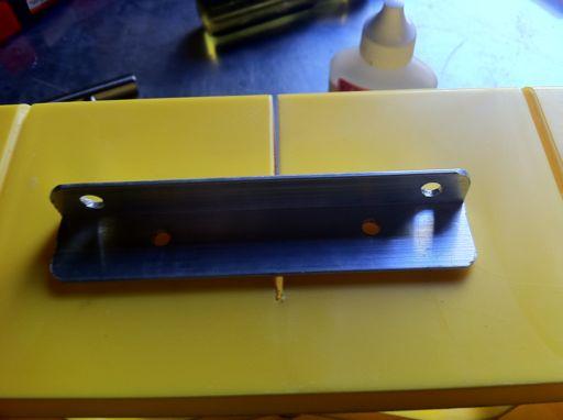 9. Drill holes for the cabinet handle on the narrower (.