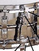 In theory, the snare should always be placed between your legs in front of you, with your right leg on the bass pedal and your left leg on the hi-hat pedal.