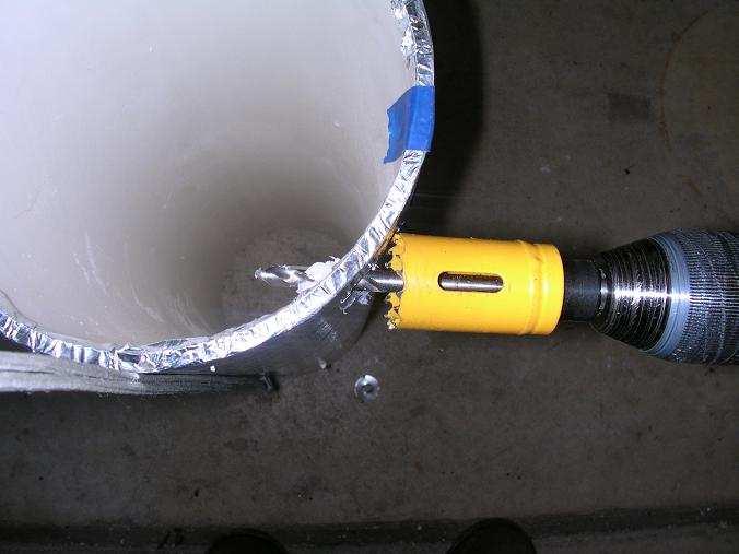 The PVC is drilled at 1 inch from the bottom with the same angle.