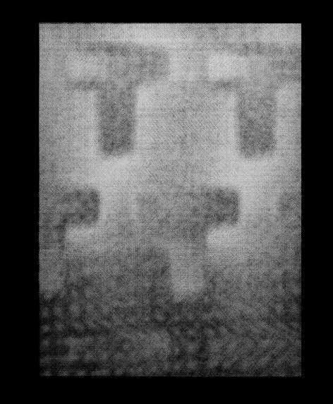 Figure 8. Transparency mode scan of a duplex print bearing a T shaped watermark pattern (after inversion and contrast enhancement). 6.