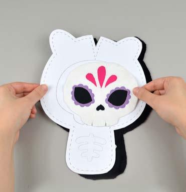 carefully pull the paper pattern away while holding the applique piece in place.