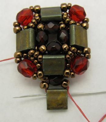 Pick up 3 copper 15/0 beads; pass through the end hole
