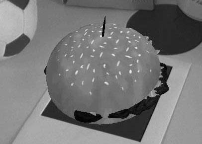 2.7. Diminished Reality 13 (a) (b) Figure 2.7: Virtual hamburger model generated in AR with simulated noise [9].