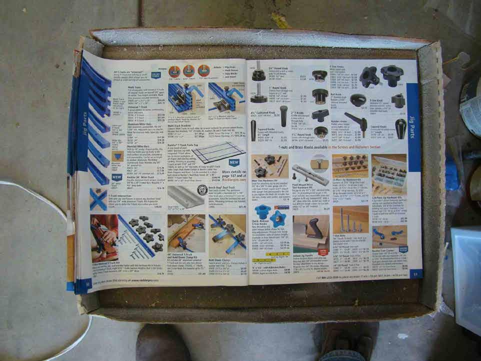 This is my fancy spray station for spraying adhesives to the backs of each pattern. It is a cardboard box and a discarded mail order catalog.