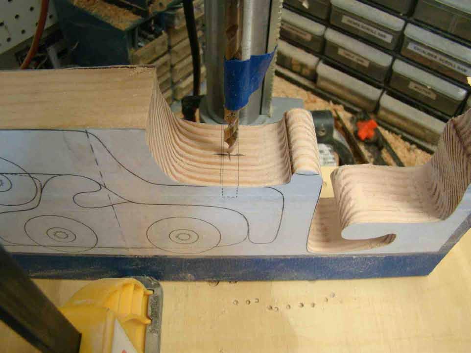 SECOND CUT - STEP 13: Now it s back to the scroll saw for the next important cut. This will be the sweep-curve that indicates the fender line of the design.