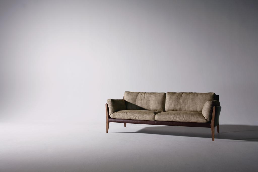 DIANA 2013 3 SEATER SOFA Design : SHINSAKU MIYAMOTO Frame : Walnut oiled finish Frame cover : Leather Cusion : Fabric The characteristic line of the back and arm frame, curving to encompass your