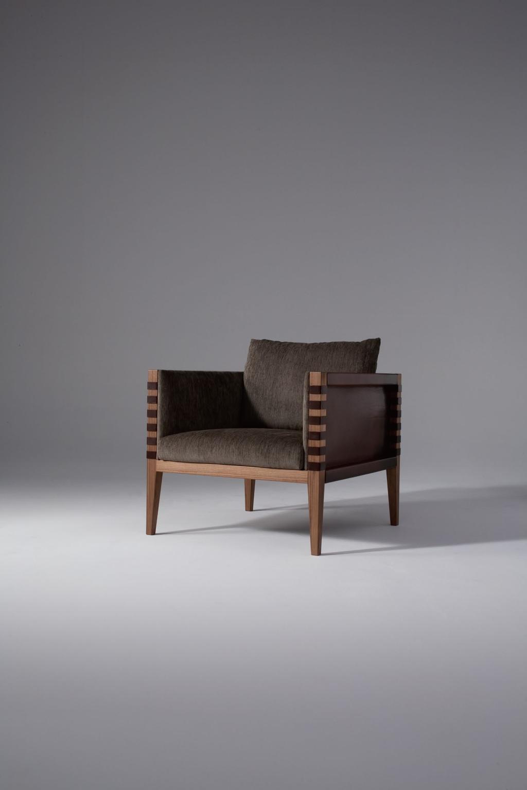 LUPIN 2014 LOUNGE CHAIR Design : ATELIER D.Q. Frame: Oiled walnut and leather Padding and Cushion: Fabric The square form of the sofa imparts a feeling of relaxation and comfort.