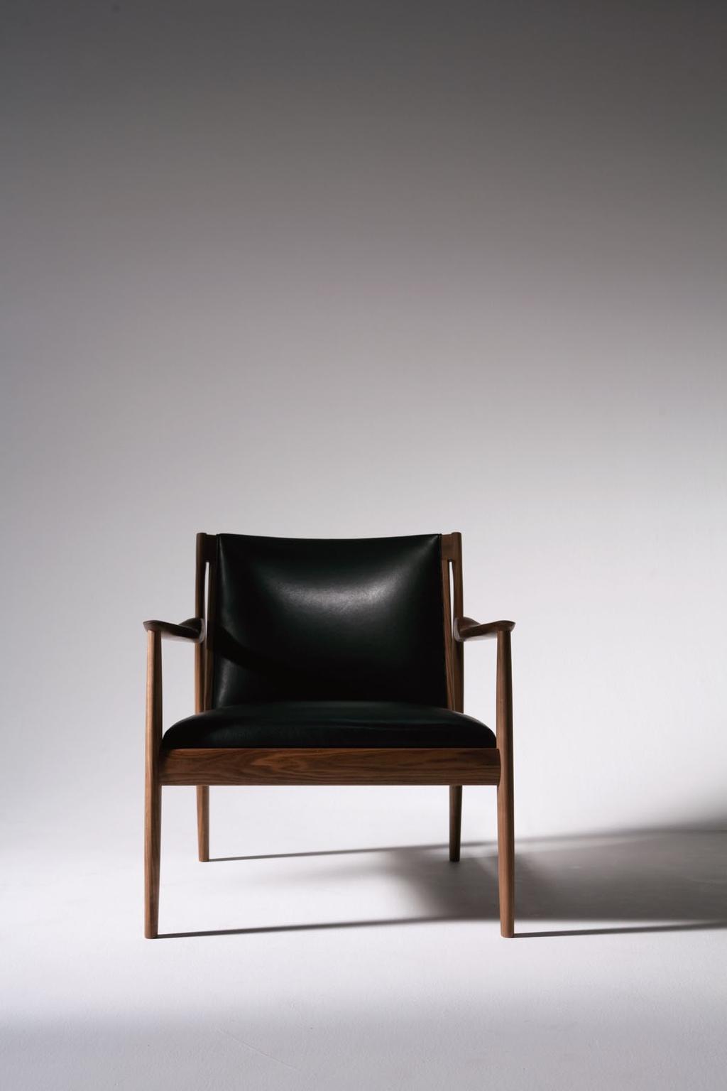 CLAUDE 2013 EASY CHAIR Design : SHINSAKU MIYAMOTO Frame : Walnut oiled finish Seat & Back : Leather The detailing on the sculptured armrests and the lines of the legs are unique, and especially the