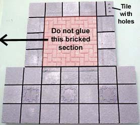 Do not glue the bricked section. Also note that there is a tile with holes in the upper right corner.