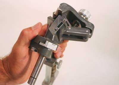 The small rod on the end-stop is used when sharpening short drills by reversing end-stop on square shaft (See photo 8).